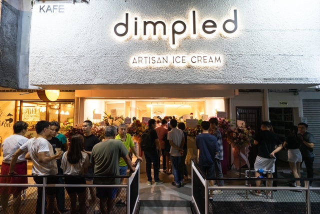 Customers gather outside dimpled