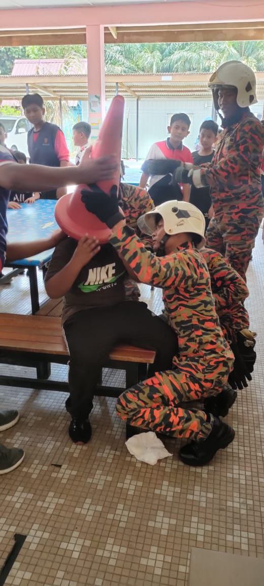 Johor firefighters free boy's head from traffic cone