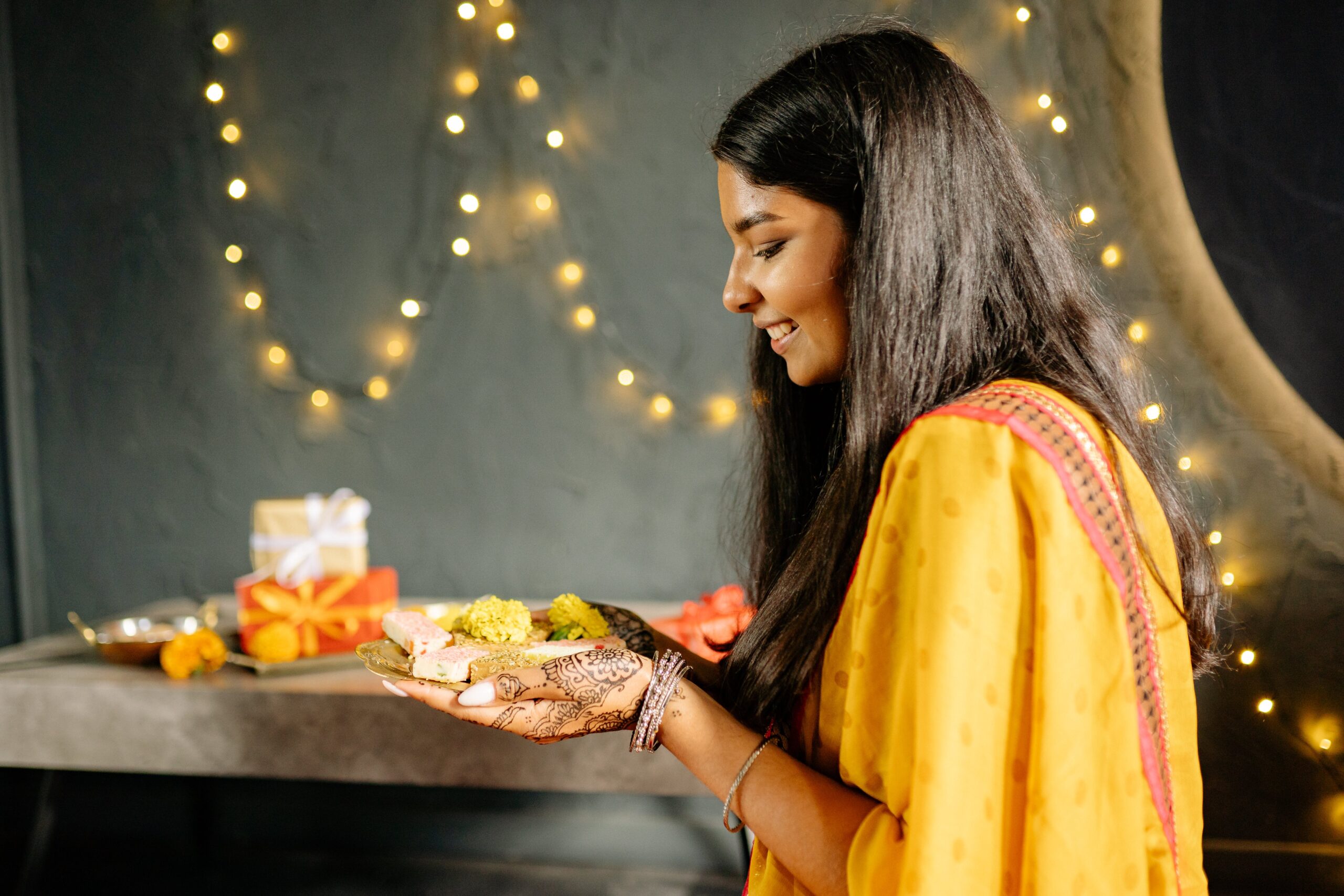 Girl holding lamp during deepavali