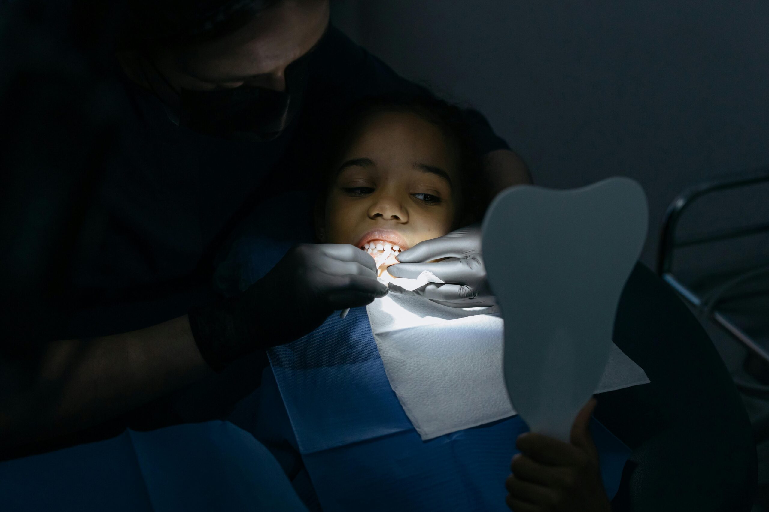 Dentist repairing patient's teeth