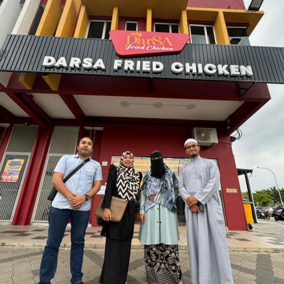 DFC founder in front of an outlet