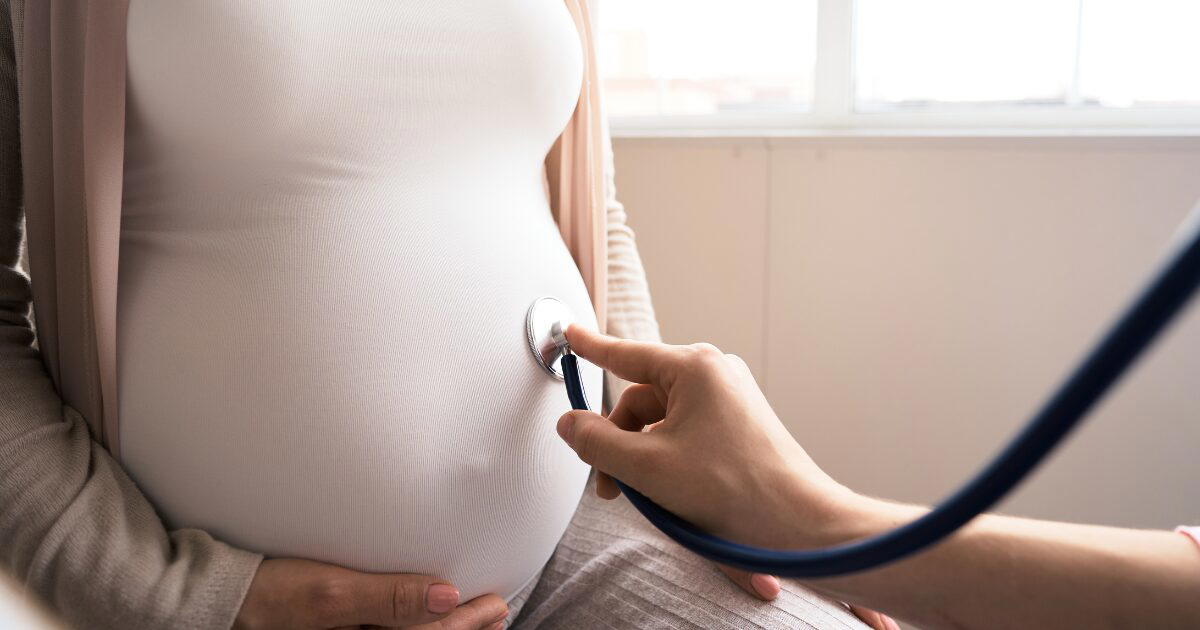 doctor checking a pregnant woman