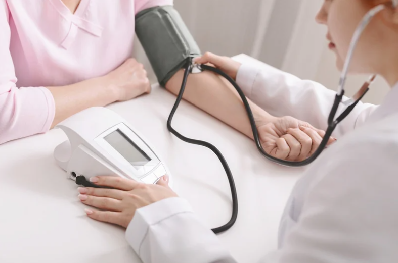 doctor taking blood pressure