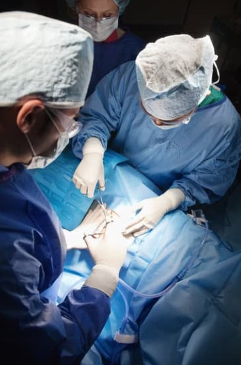 Doctors performing c-section