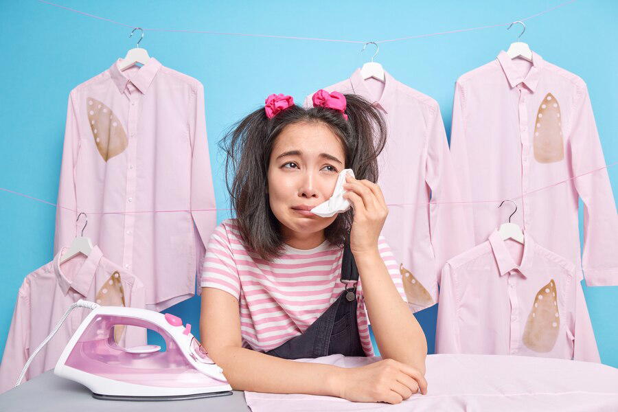 A girl crying because she doesn't know what to wear