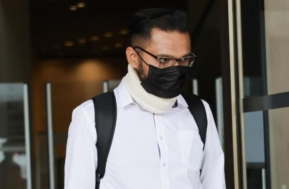 Durairaj santiran, a former ex-steward of singapore airlines coming out from a buliding