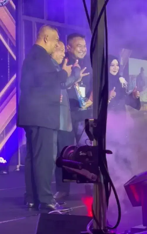 employee receiving award at annual dinner