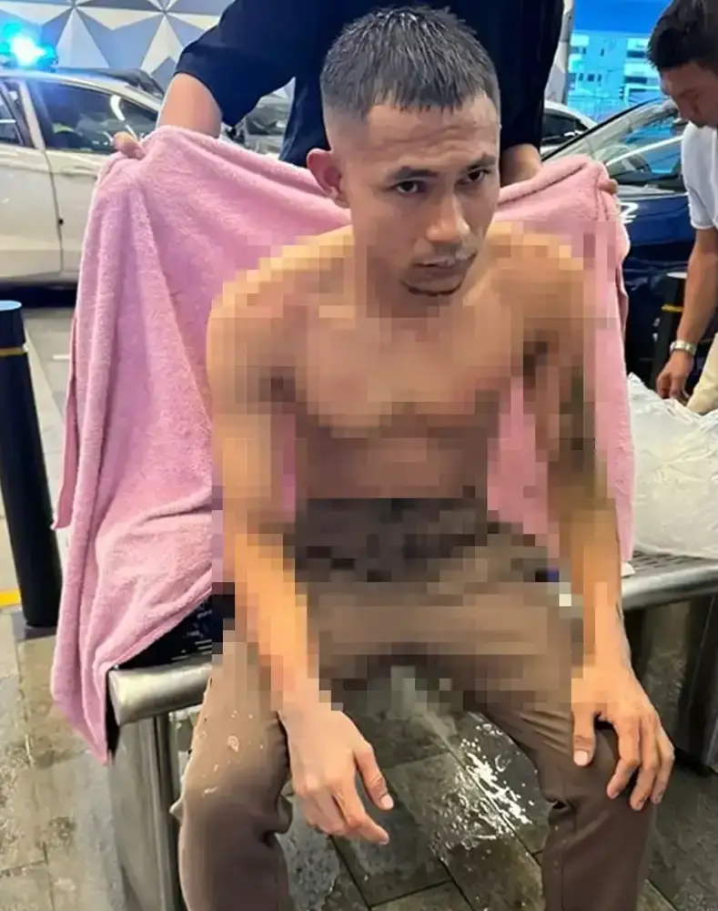 Faisal halim covered with a towel after acid attack