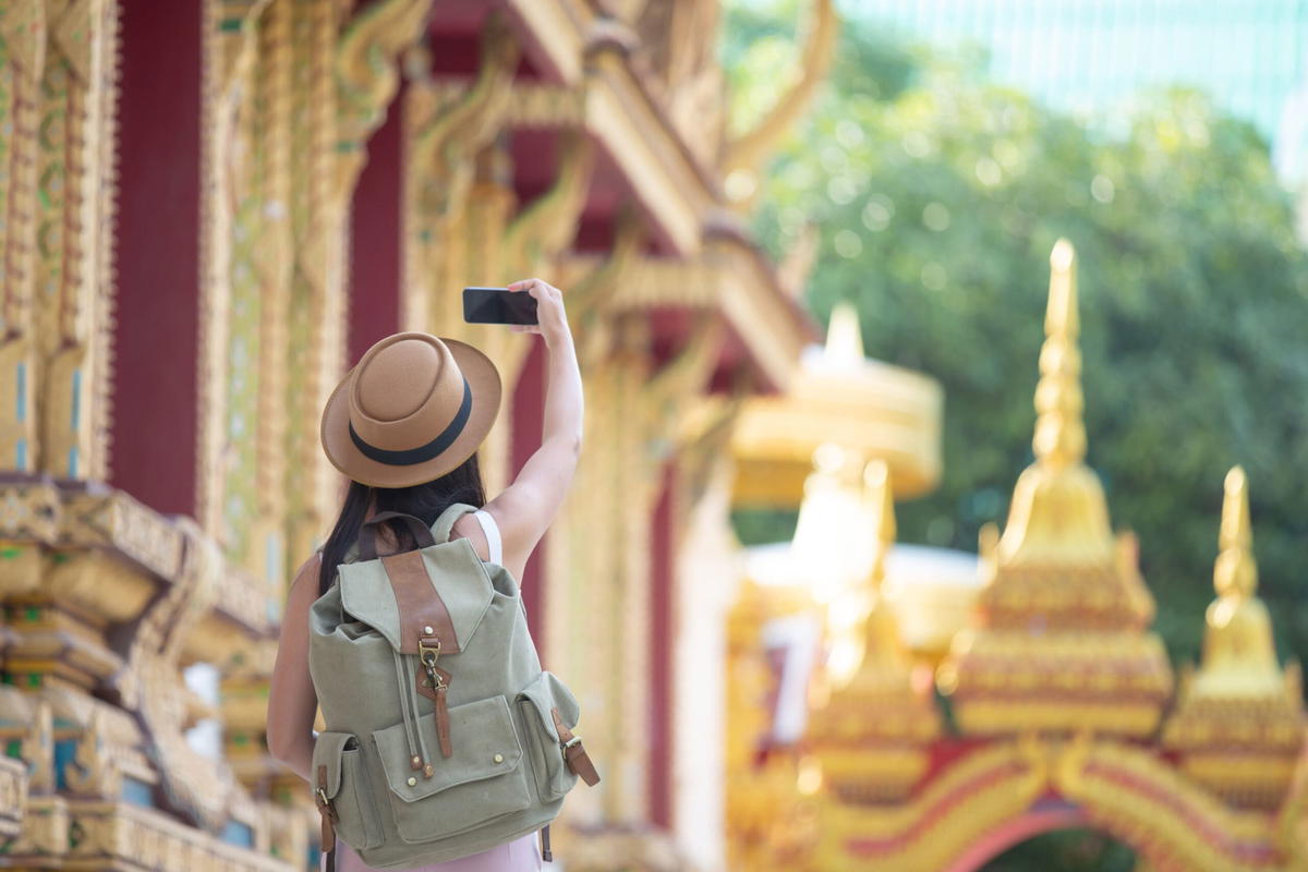 Tourist taking picture of bangkok's tourist sites