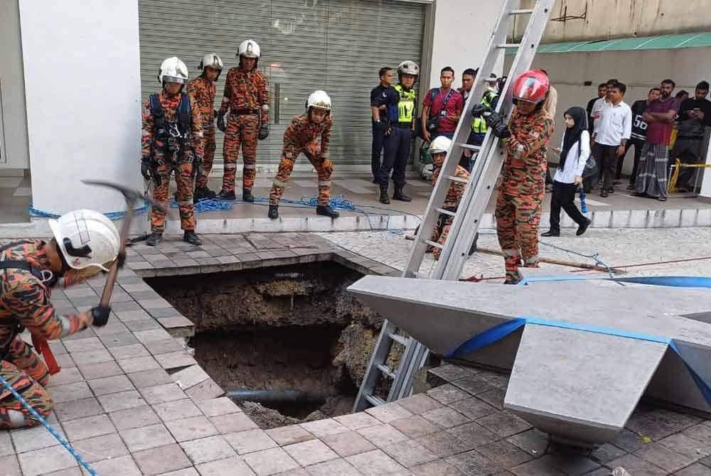 Firefighters looking for woman who fell into sinkhole