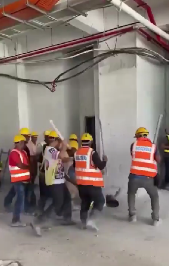 foreigner hitting a guy with iron rods