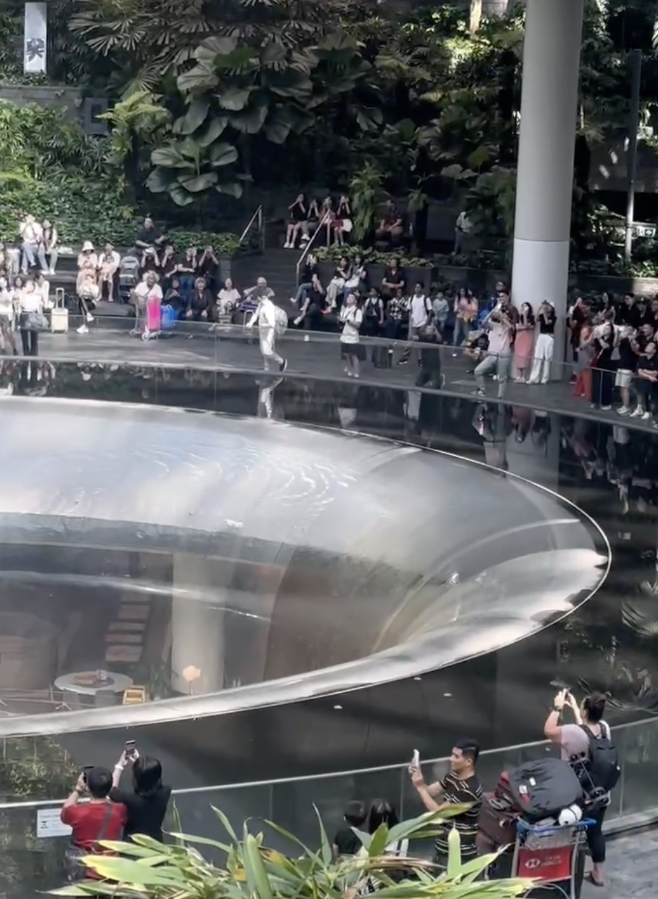 Foreigner spotted on his knees praying in front of sg's iconic jewel changi rain vortex