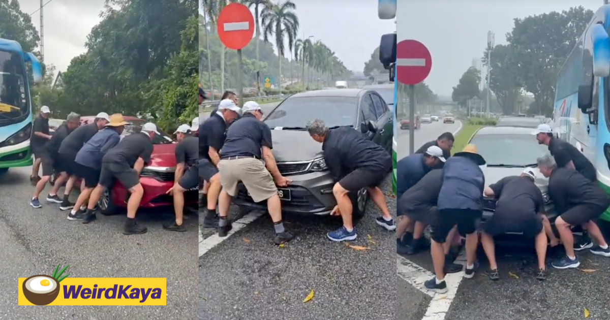 Group of tourists work together to move cars blocking bus lane in kl, earns praise online | weirdkaya