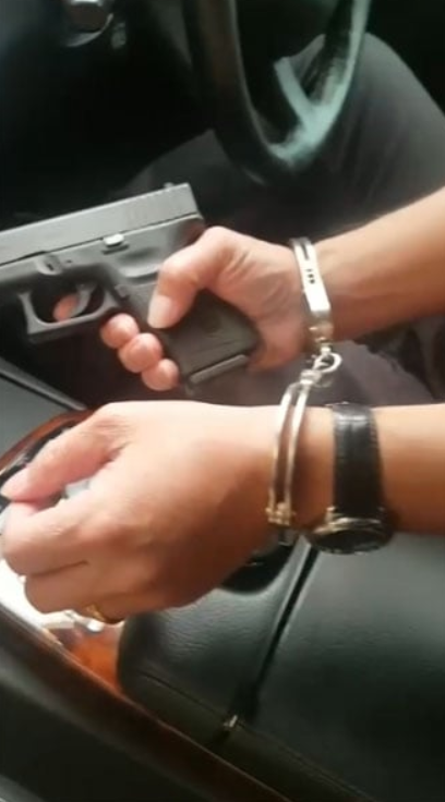 M'sian man poses with a gun while handcuffed, now remanded for 4 days by police