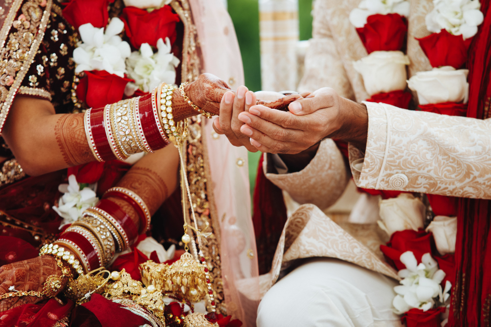 Hands-indian-bride-groom-intertwined-together-making-authentic-wedding-ritual