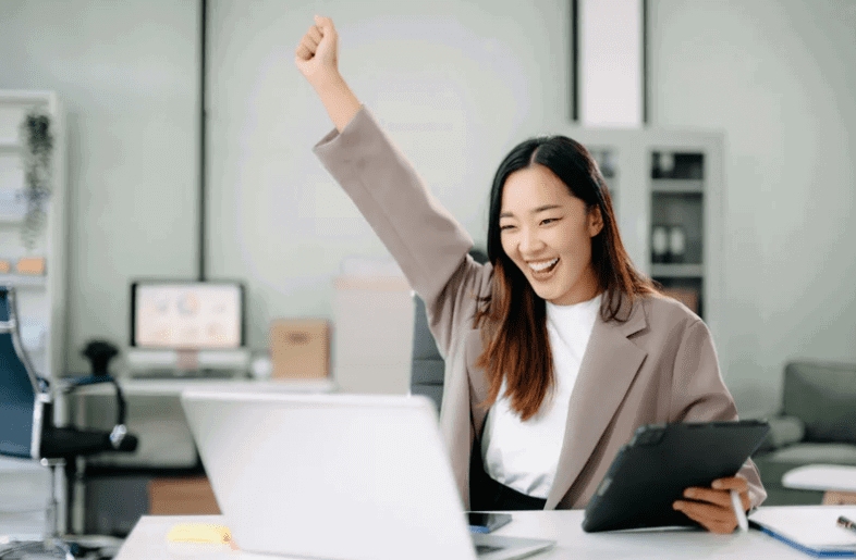 happy Asian woman at work
