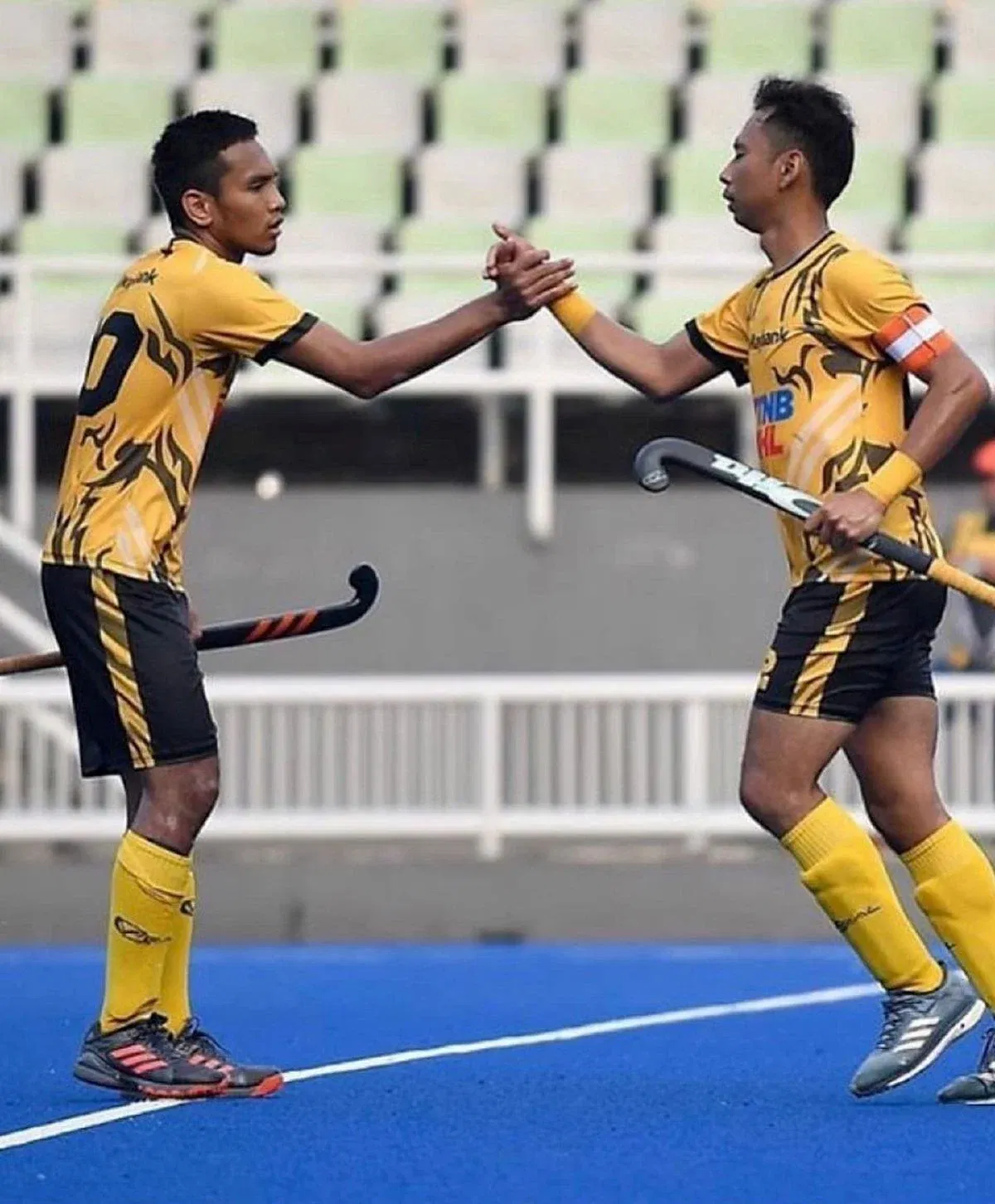 haziq playing hockey