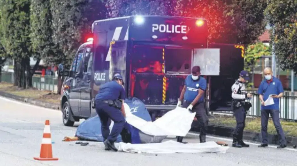 His body covered at the scene