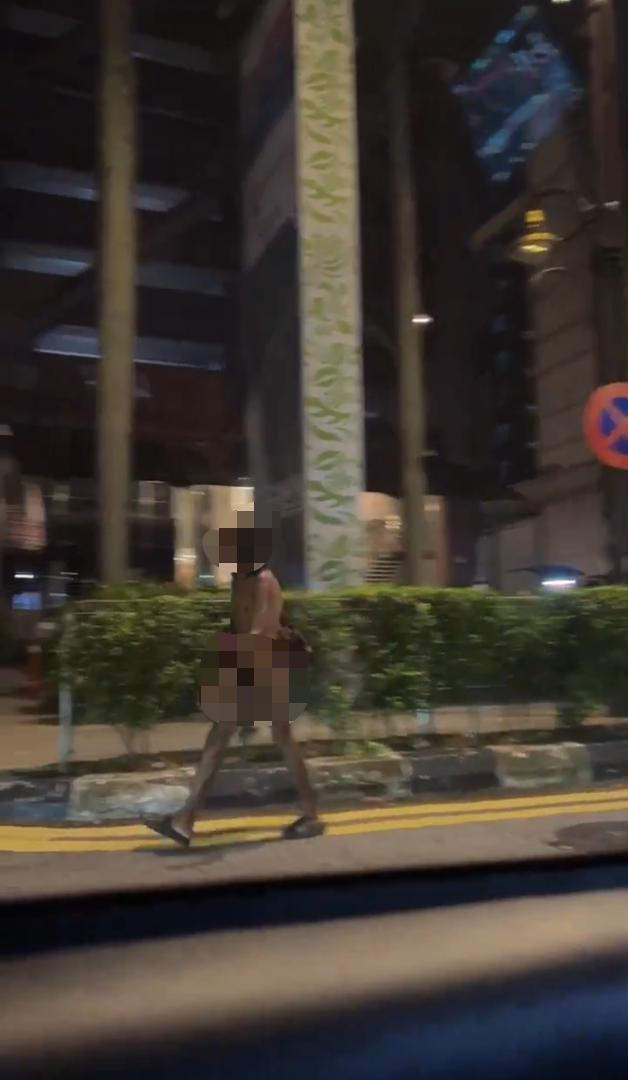 Homeless man walking naked at kl