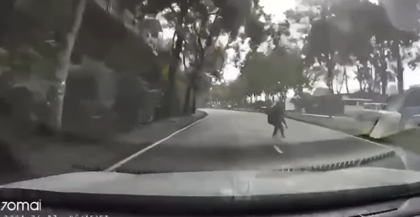 Homeless woman runs to the middle of the road in jb