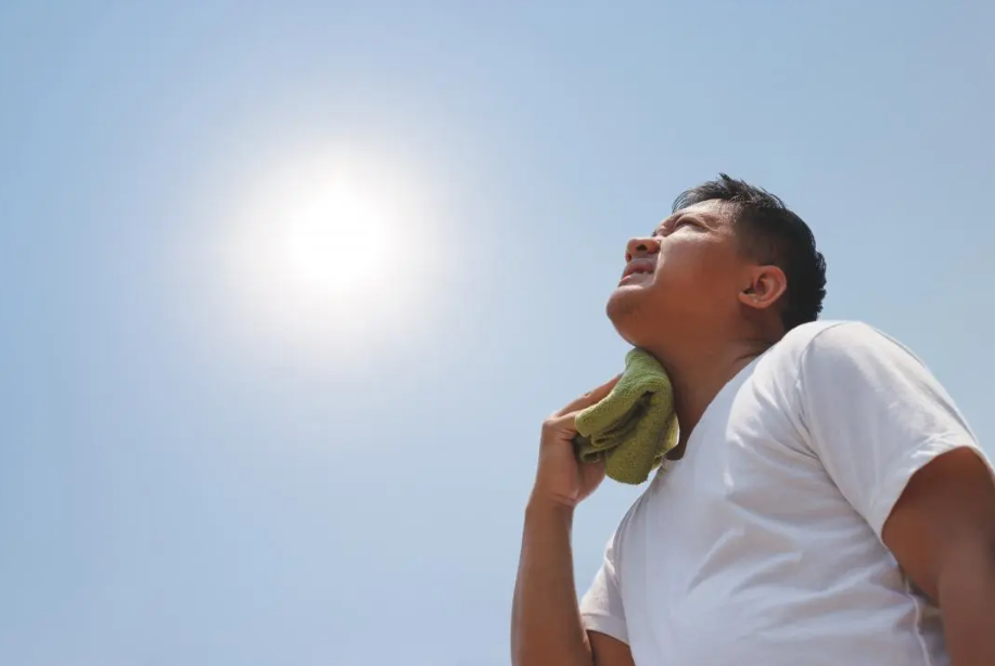 Man sweating under the sun