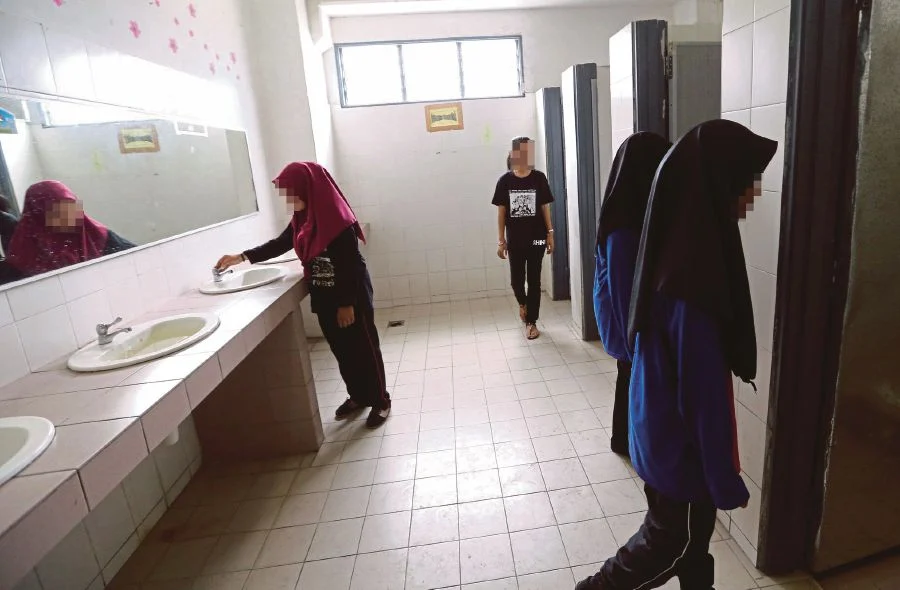 Students using a toilet