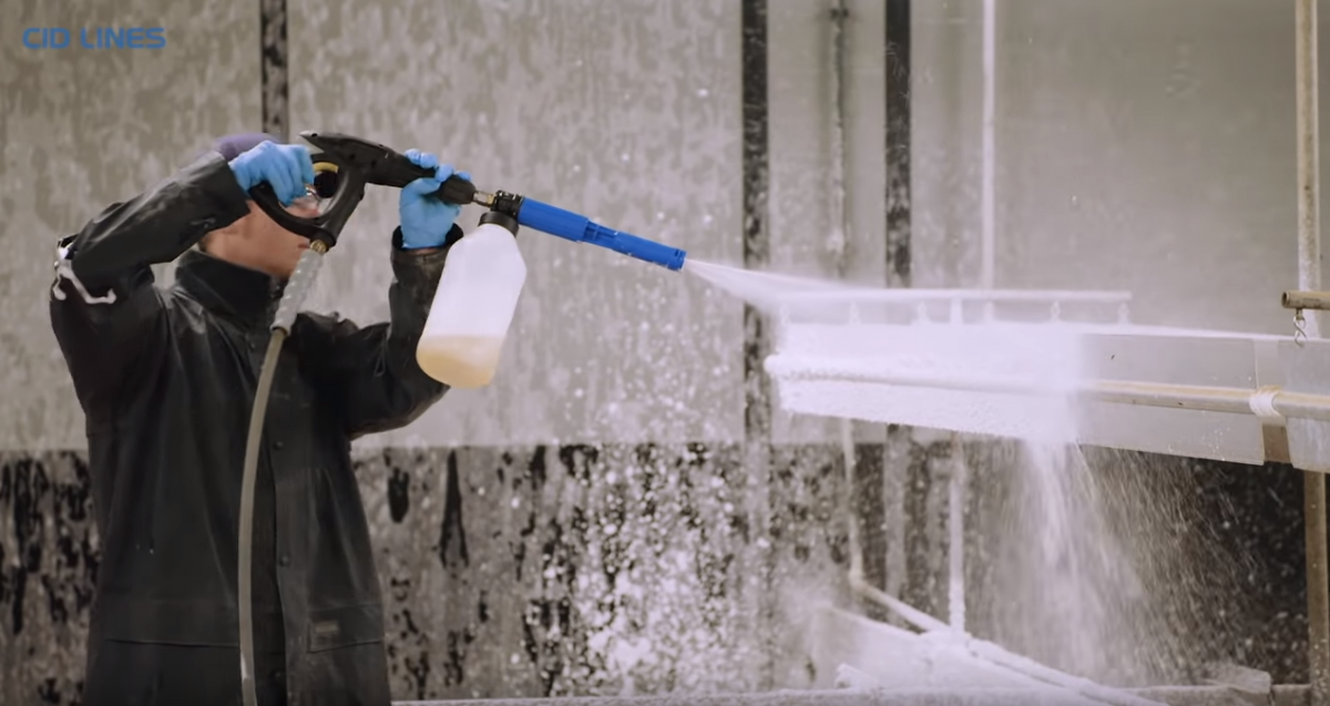 Man carrying out disinfection procedure