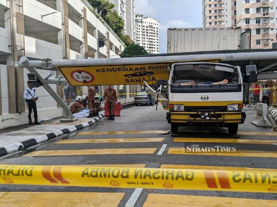 Driver crushed by falling road sign