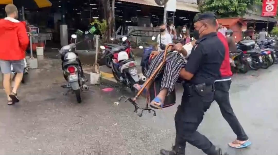 Kindly police officer lifts up senior woman  across the road and pays for her meal