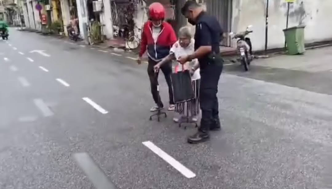 Kindly police officer lifts up senior woman  across the road and pays for her meal