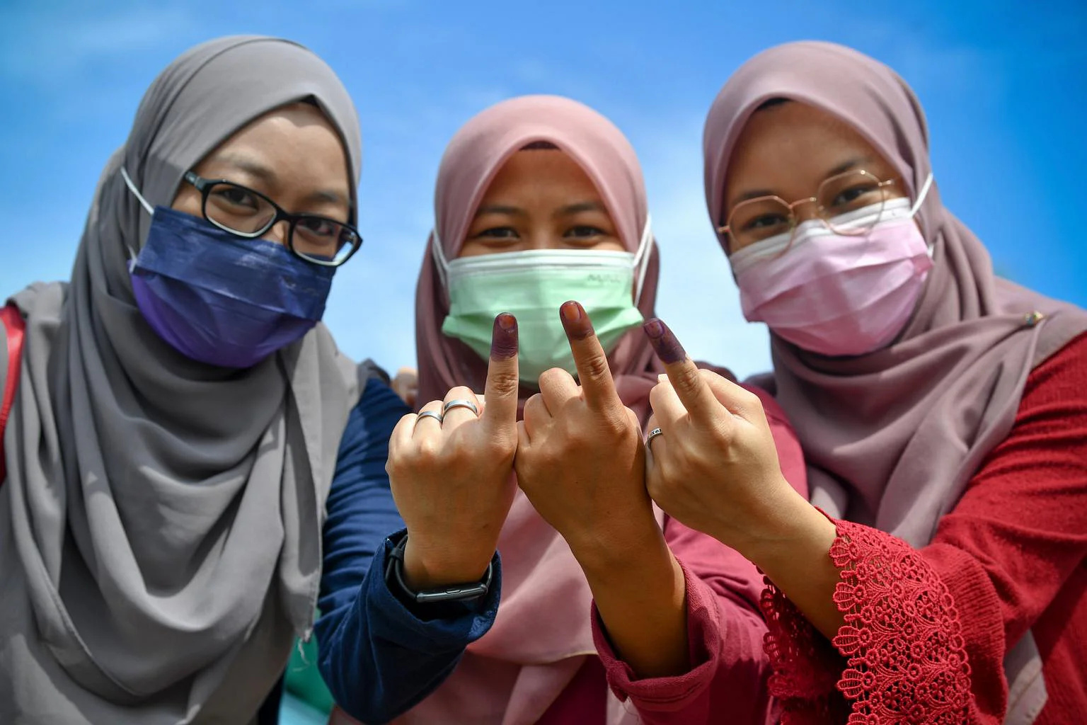 M'sians showing inked fingers