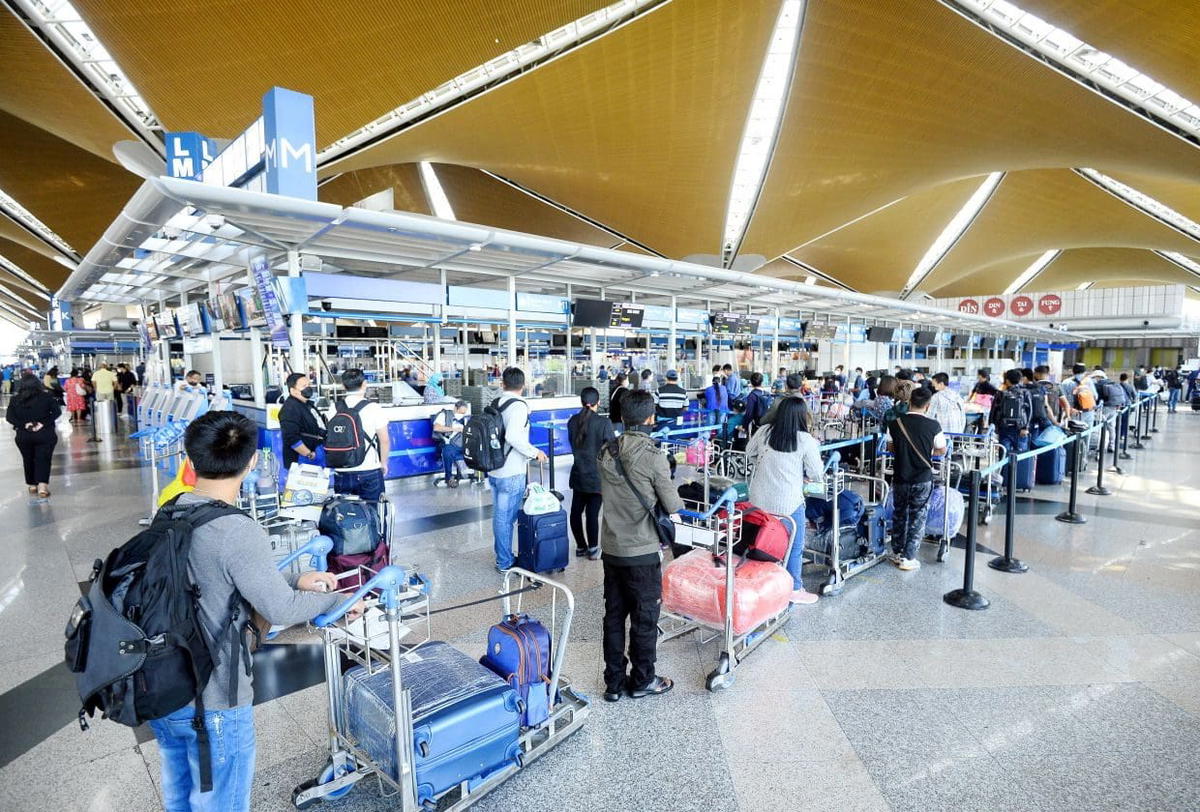 Travellers lining up at KLIA