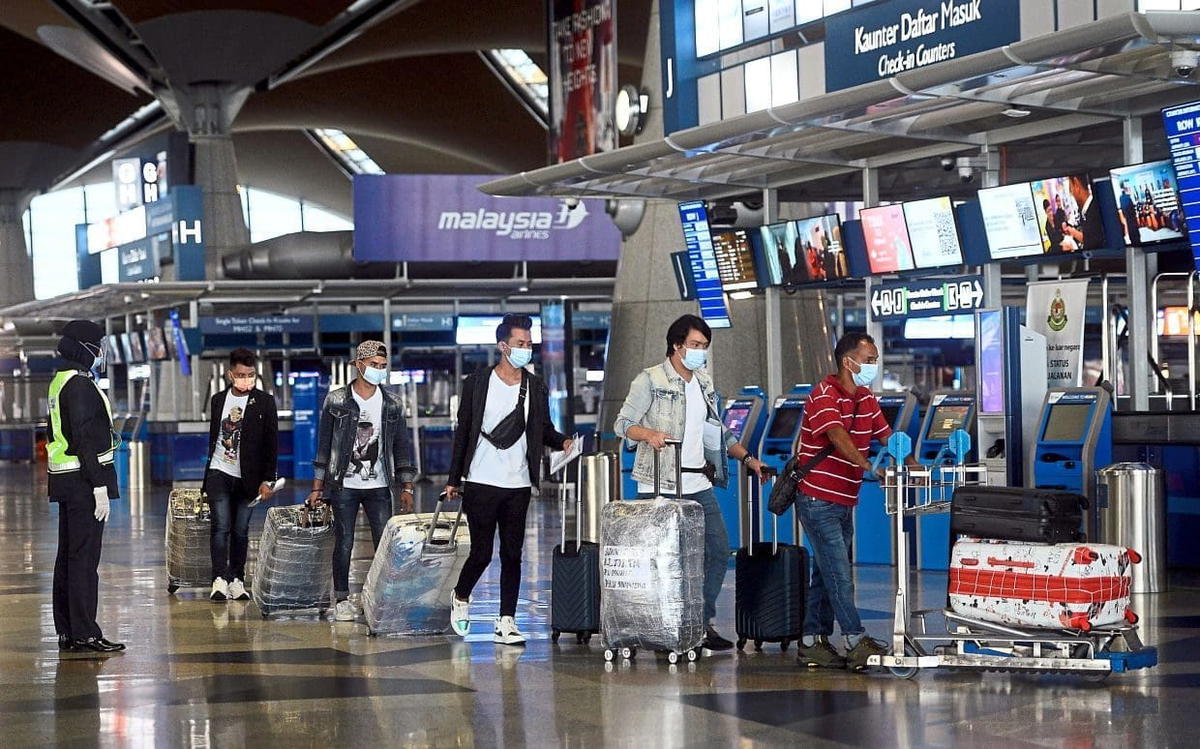 Travellers lining up at KLIA