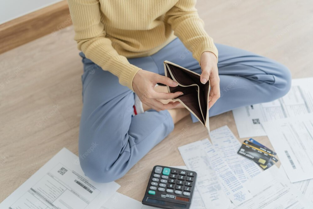 Woman opening an empty wallet