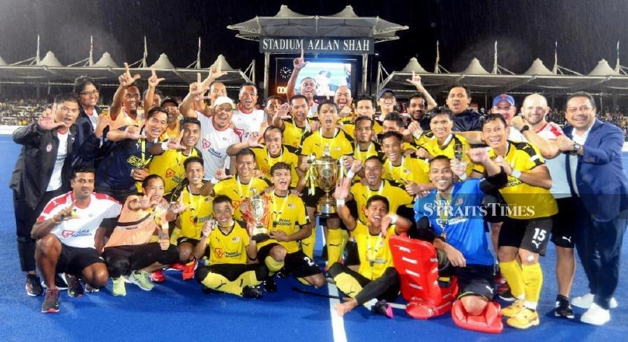 Malaysian hockey team celebrating win