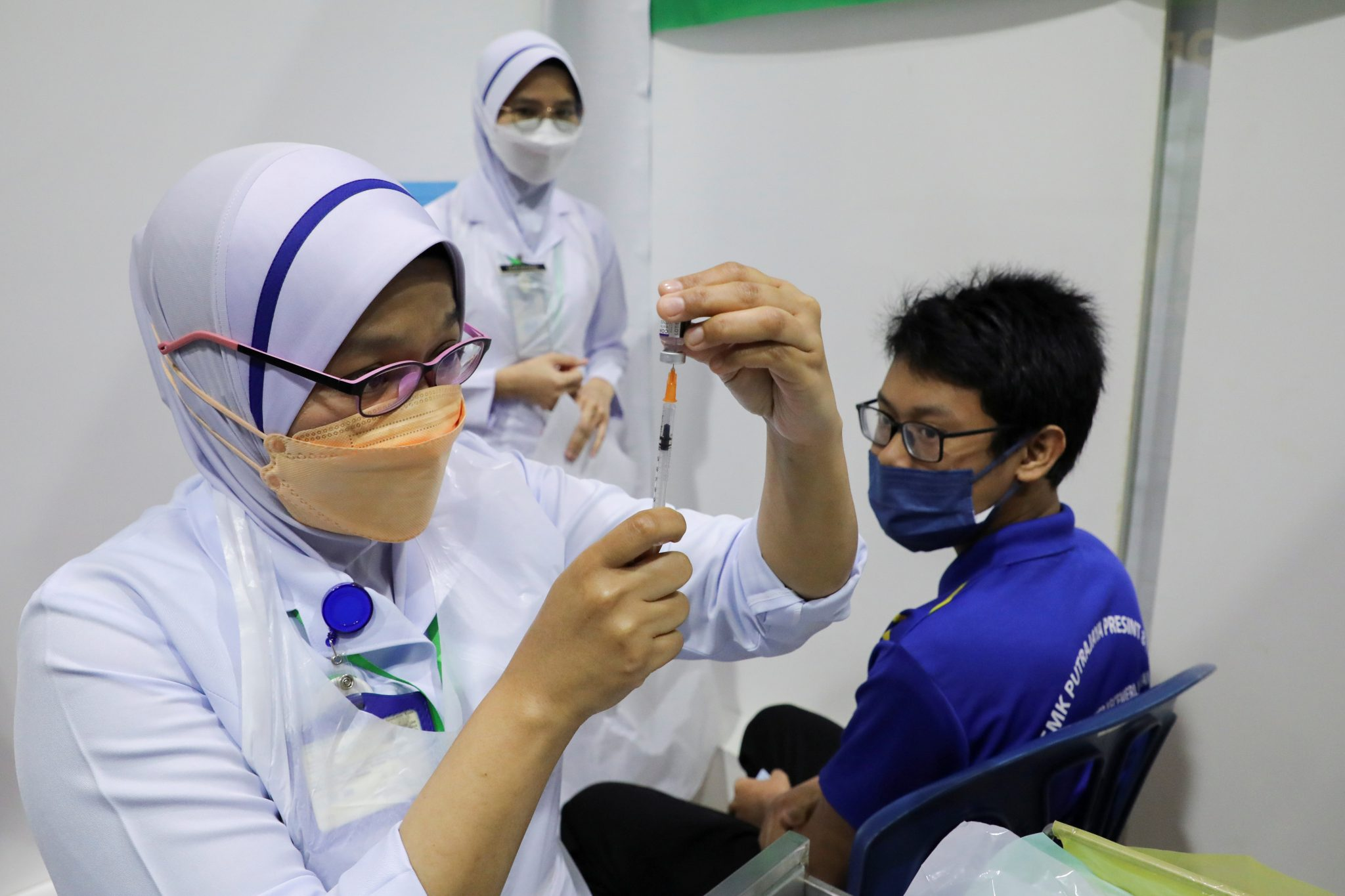 Nurse giving the covid-19 vaccine