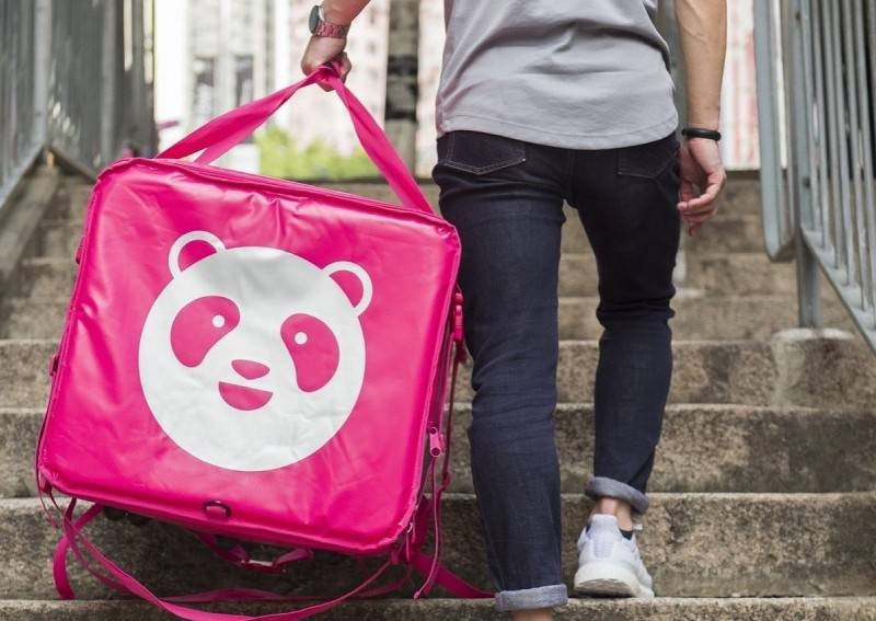 Foodpanda delivery rider climbing up the stairs