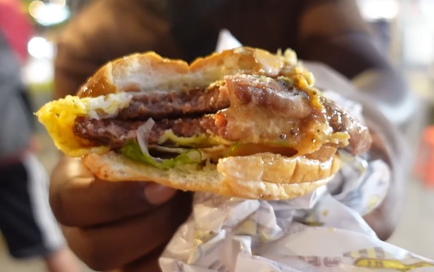 Half-eaten ramly burger