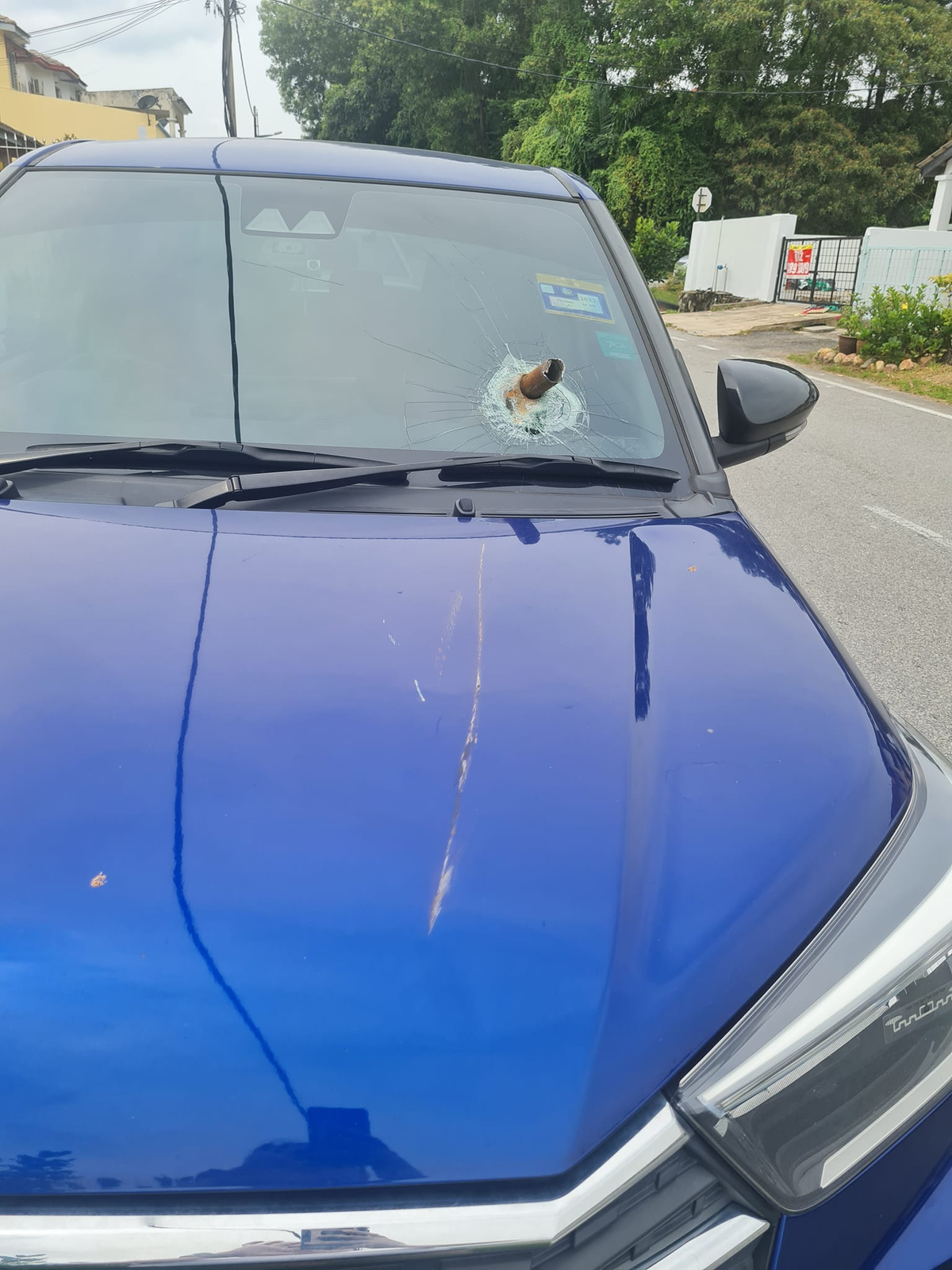 Windshield damaged by metal rod