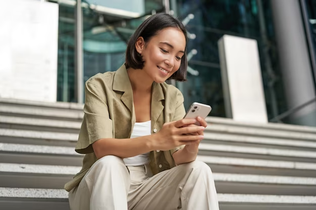 Young woman using her handphone