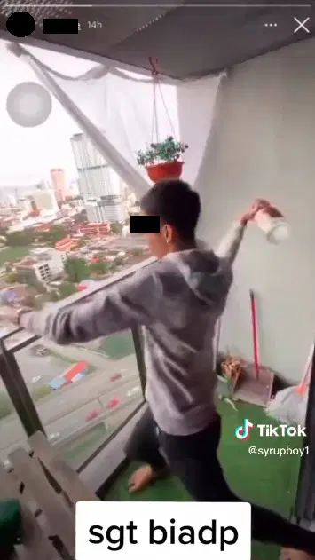 Man throws empty whiskey bottle from balcony