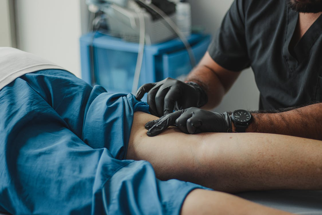 Doctor examining patient's knee