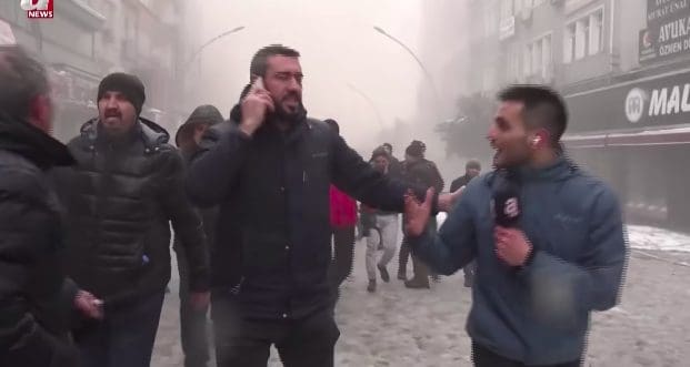 Reporter Yuksel Akalan doing a live broadcast of Turkey earthquake