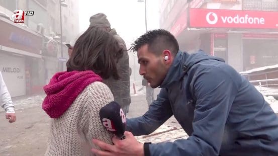 Reporter Yuksel Akalan comforts young girl in Turkey earthquake