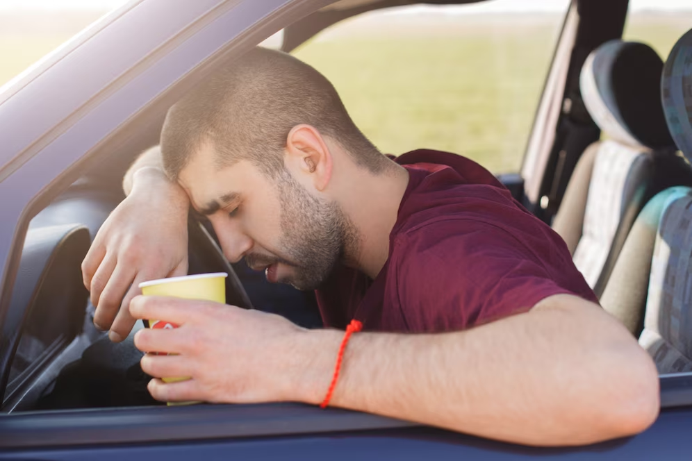 Man taking a nap inside the car