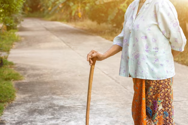 Old woman walking with a walking stick