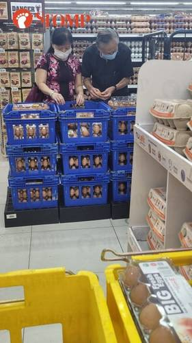 S'porean supermarket chain warns against product tampering as couple spends 15 minutes selecting eggs from opened cartons