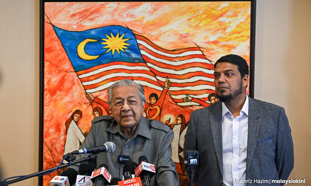 Mahathir mohamad speaking at a press conference