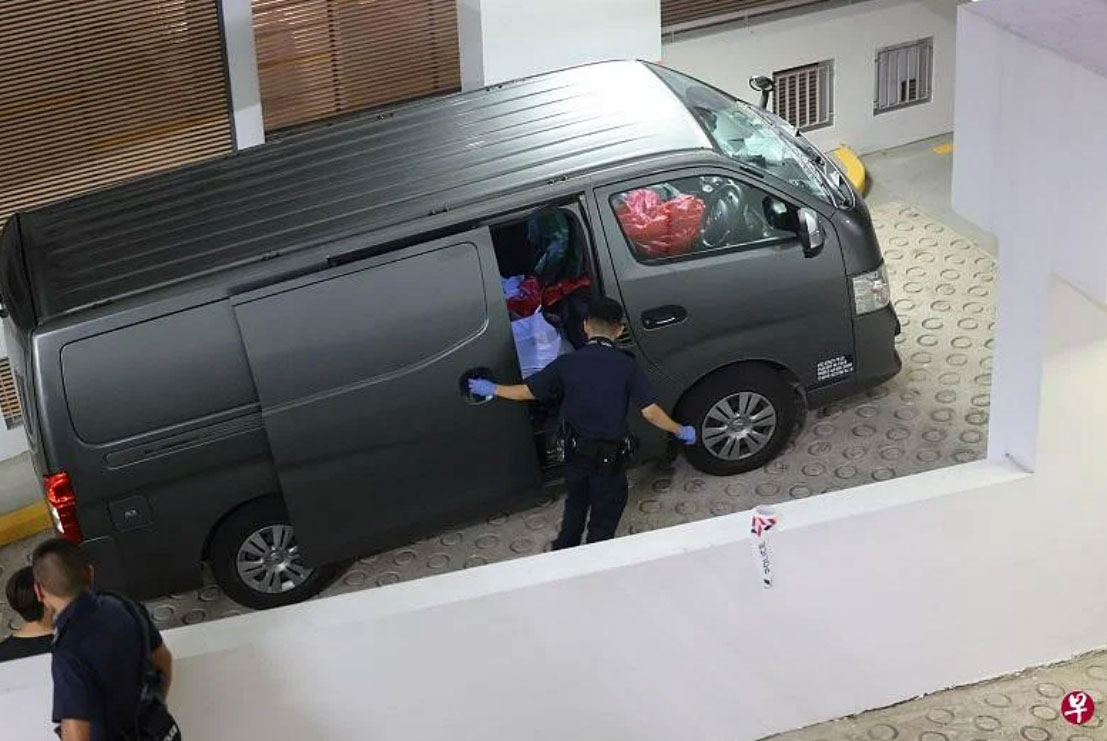 Sg man continues to wash car calmly as another man gets arrested at car park