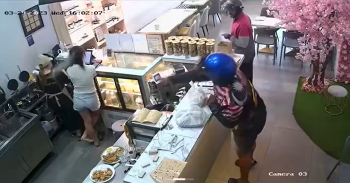 Shocking cctv clip shows foodpanda rider throw drink at female worker at penang restaurant